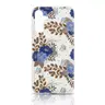 A15 - Flower cover with golden details and blue flowers.